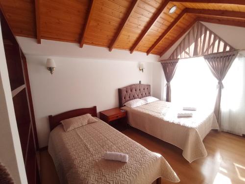 Ένα ή περισσότερα κρεβάτια σε δωμάτιο στο Villa Graciela I