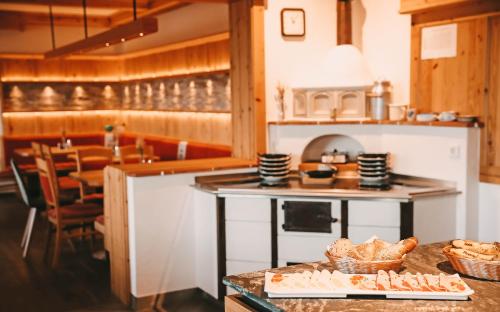 a kitchen with a table with baskets of food on it at Posers Bergwelt B&B in Schladming