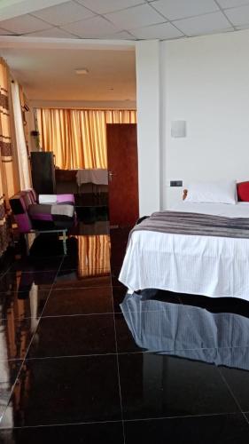 a hotel room with a bed and a desk at Air Vision 98 in Katunayake