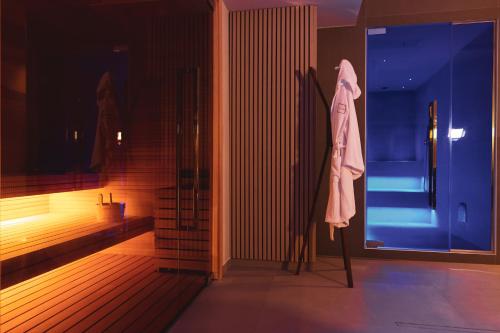Postel nebo postele na pokoji v ubytování Moma Hotel Wellness & Spa
