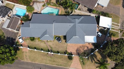an overhead view of a house with a roof at Dreamers nest in Richards Bay