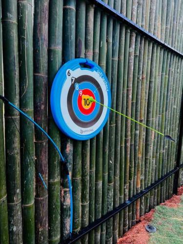 a target on the side of a bamboo fence at The Black Box Villa - Genting Highland Foot Area in Bentong