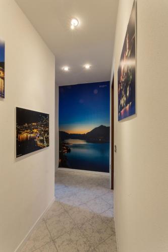 a hallway with two pictures on the wall at Fall In Love with Como Lake in Bellano