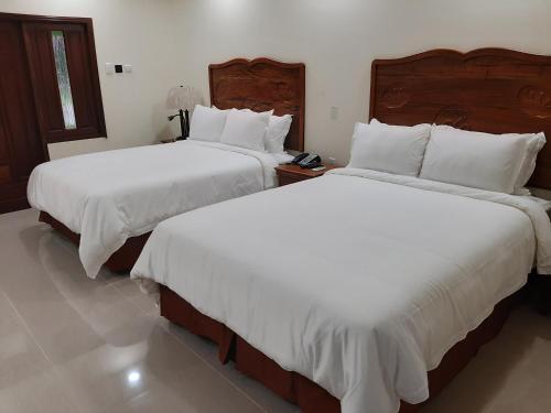 Postel nebo postele na pokoji v ubytování PESHERES INN & SPA