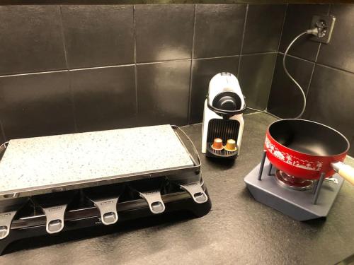 a kitchen stove with a pot on top of it at La Majorie de Nendaz in Nendaz