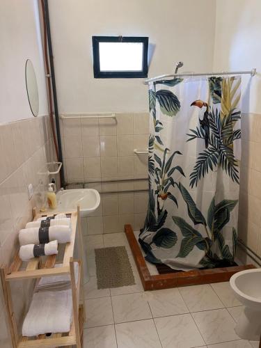 a bathroom with a shower and a sink at Baia Seixal Oceanfront in Seixal