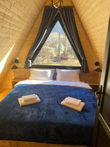 מיטה או מיטות בחדר ב-Cottages LIZA