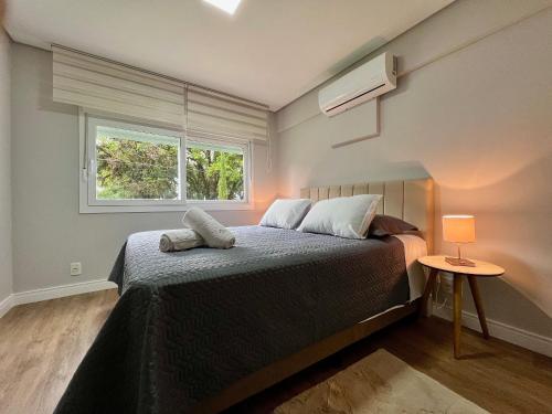 Postel nebo postele na pokoji v ubytování Delle Alpi 2 dorm ao lado Roda Gigante by Achei