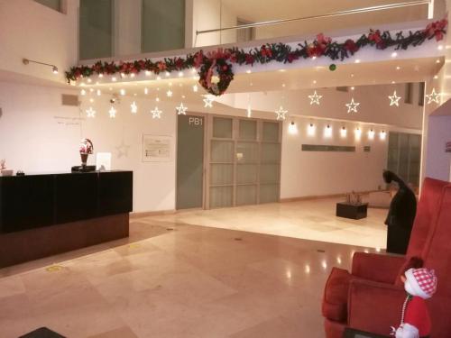 a large room with christmas lights on the wall at Suites Teca Once in Mexico City