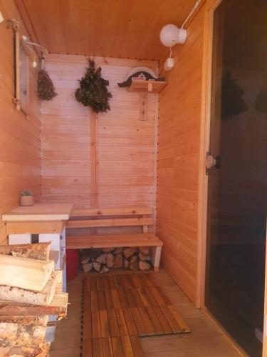 a sauna with a bench in a wooden room at Stuga i Storklinten in Harads