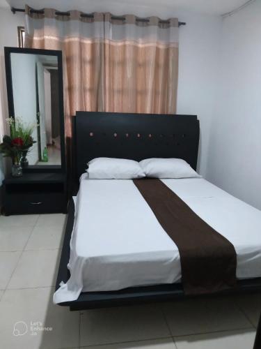 Ένα ή περισσότερα κρεβάτια σε δωμάτιο στο Apartamentos The Harbor Cali 102