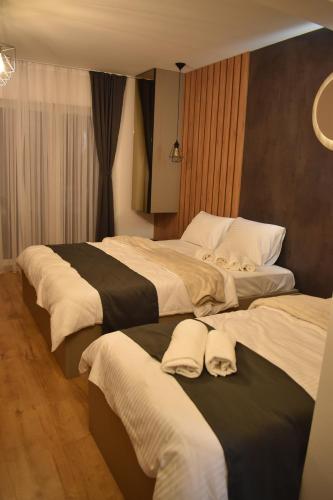 Postel nebo postele na pokoji v ubytování Villa E&M