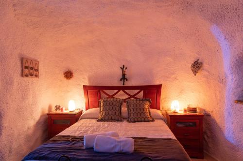 Postel nebo postele na pokoji v ubytování Casa cueva con encanto