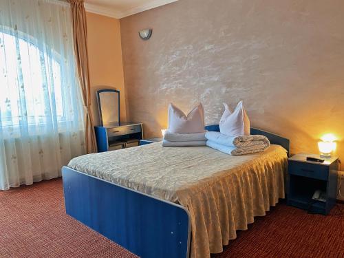 Säng eller sängar i ett rum på Hotel Belvedere
