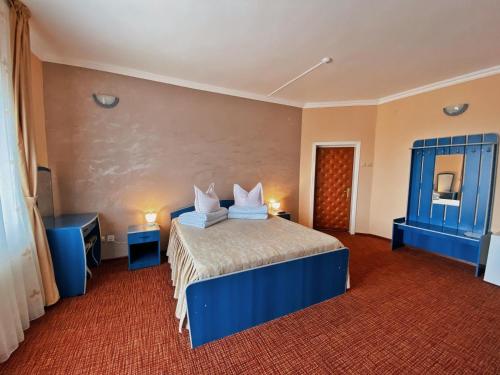 Ein Bett oder Betten in einem Zimmer der Unterkunft Hotel Belvedere