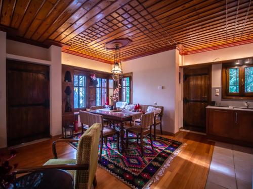 a dining room with a table and chairs at KP113 All Season Villa in Makrinitsa in Makrinítsa