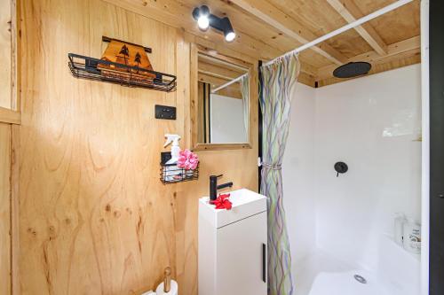 a tiny bathroom with a sink and a toilet at Holiday with Nature in Cooran