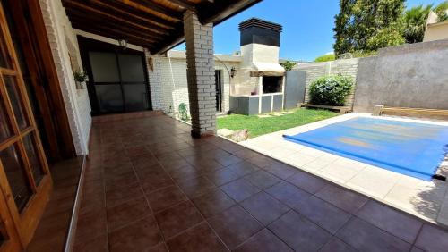 a patio with a swimming pool next to a house at Casa Simona in San Rafael