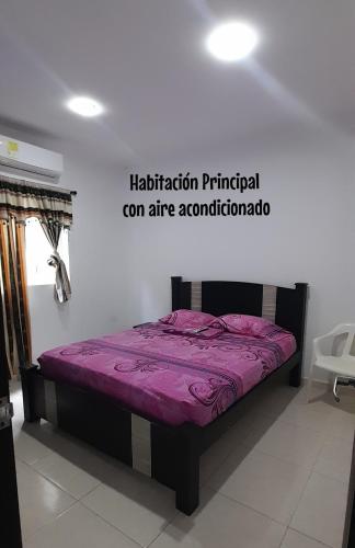 a bed in a room with a purple mattress at Apartamento JHON in Coveñas