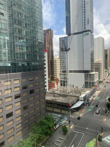 an aerial view of a city with tall buildings at Garden Hostel in Auckland