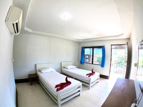 Katil atau katil-katil dalam bilik di JR GYM & Resort