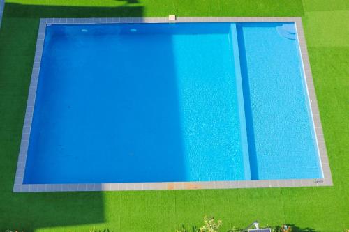 an overhead view of a blue swimming pool at Adventure Dome Resort in Kep