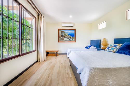 Ένα ή περισσότερα κρεβάτια σε δωμάτιο στο Villa Casiopea
