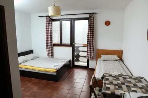 A bed or beds in a room at Apartments Dviletov Kutak