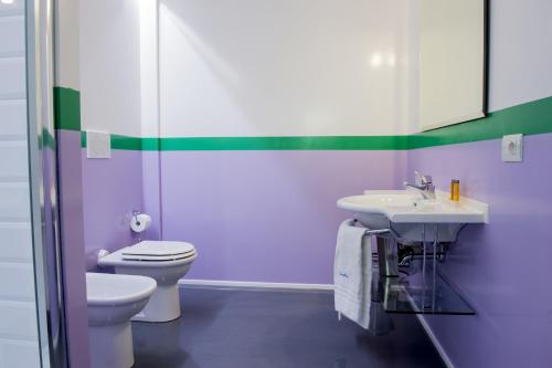 a bathroom with a toilet and a sink at Il Castelluccio in Arezzo