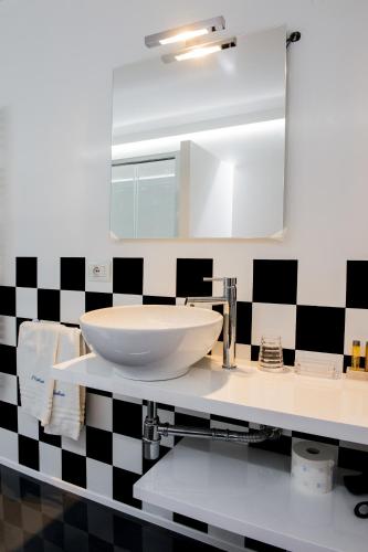 a bathroom with a sink and a mirror at Il Castelluccio in Arezzo