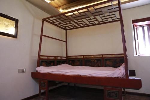 Katil atau katil-katil dalam bilik di Tulou Fuyulou Changdi Inn