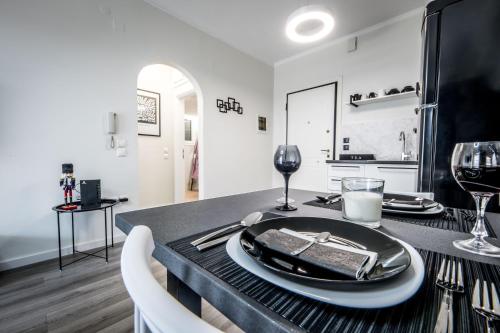 a table with a plate of food on top of it at Escape Luxury Apartment in Nafplio
