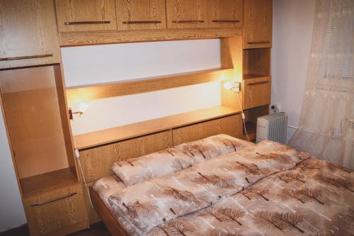 a bed in a room with a window and a bed sidx sidx sidx at 3 Rooms, Loft Apartment, Located RIGHT in CENTER!!! in Razgrad