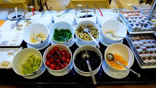 a table topped with bowls of different types of food at Grand Niki Hotel & Spa in Antalya