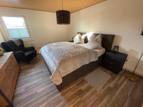 Ένα ή περισσότερα κρεβάτια σε δωμάτιο στο Unser Ferienhaus im Harz