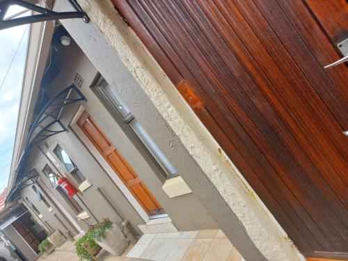 a close up of a wooden door of a house at sediba guest house in Krugersdorp