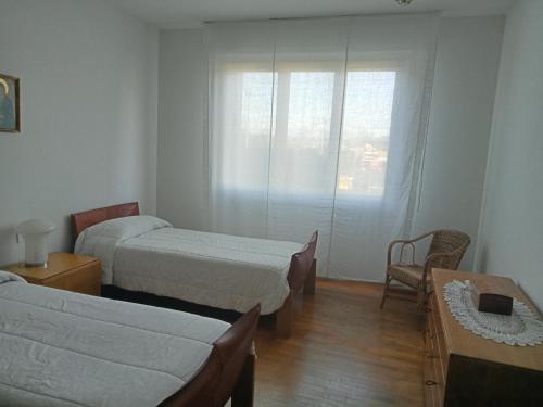 Ένα ή περισσότερα κρεβάτια σε δωμάτιο στο Residenza Relax Quinto Alto Sesto Fiorentino Firenze