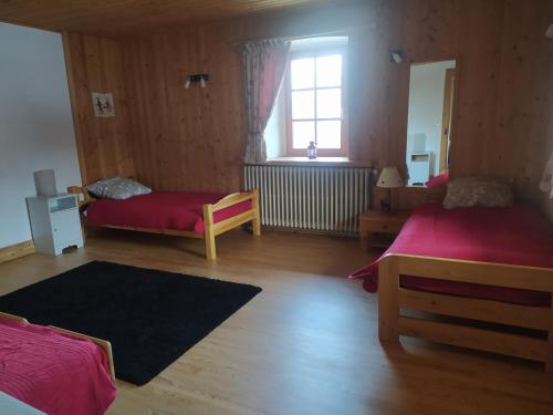 Postel nebo postele na pokoji v ubytování La Ferme des Michaud