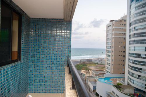 a view of the ocean from the balcony of a building at Apartamento Auto padrão 2 quartos vista mar praia da armação in Salvador
