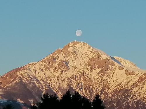a mountain with the moon in the sky at La dimora degli Angeli in Moggio