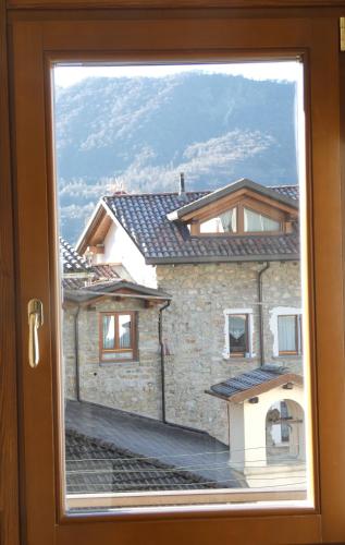 a view of a building through a window at La dimora degli Angeli in Moggio