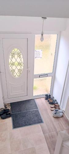 a group of shoes standing in front of a door at excessivEDemand home in Thorne