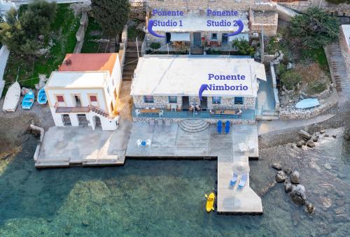 an aerial view of a building with a swimming pool at Ponente in Symi
