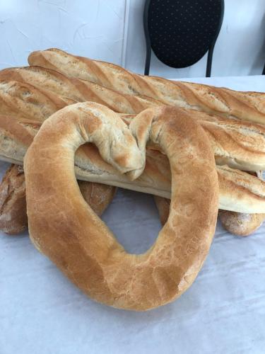 a loaf of bread with a pretzel in the shape of a heart at le DOMAINE D HELANT in Ecquedecques