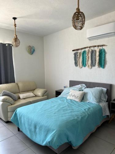 Ένα ή περισσότερα κρεβάτια σε δωμάτιο στο Casa Aqua, con alberca y club de playa