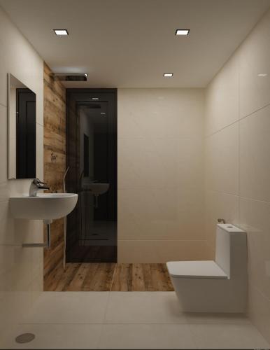 a bathroom with a toilet and a sink at Shell Park in Kanyakumari