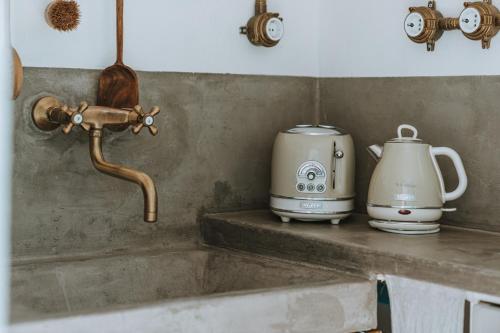 a kitchen sink with a coffee maker and a mixer at Serifos Sugar Cubes in Serifos Chora