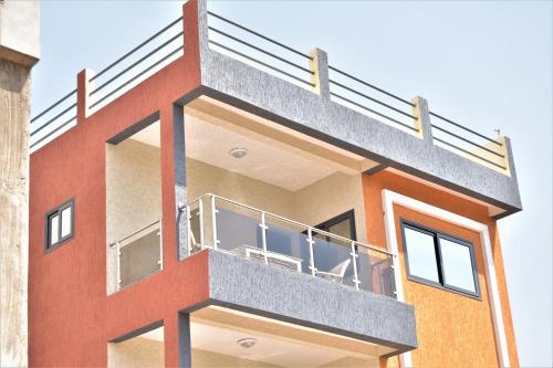 a rendering of a building with a balcony at RÉSIDENCE BELLEVUE SITO AIPORT- Lomé in Lomé