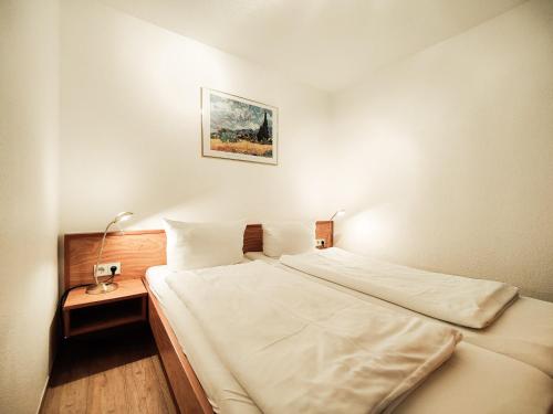 Llit o llits en una habitació de Die Kogge - Wohnung 14