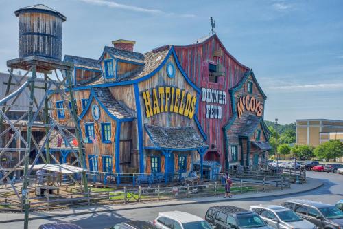 a building painted to look like a house at 5Bd5B Escape Cabin with 2 HotTubs, Thtr &Game Rm,1mi to the Parkway! 4mi to Dollywood - Spring Deal in Pigeon Forge